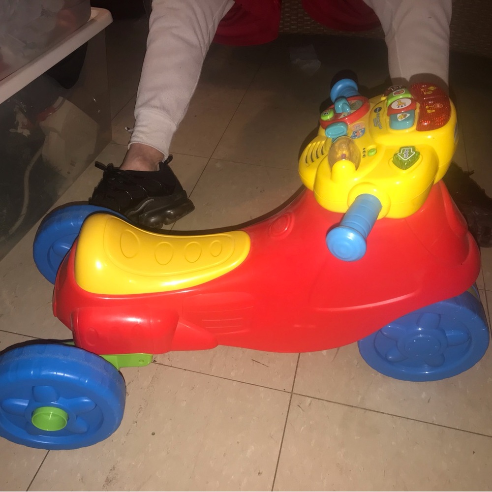 Bright Red and Yellow Ride-On Car with Four Wheels and Dashboard